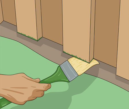 Visar en hand som håller i en fasadpensel som stryker impregneringsolja på ändträ. 