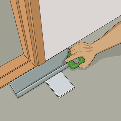 Sågar av dörrfoder vid klinkerplatta
