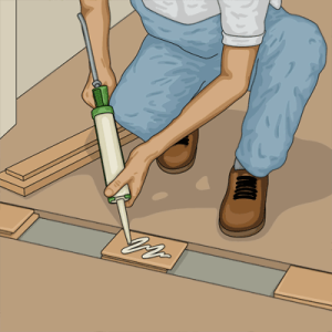 Lägger kilklossar för att få upp tröskeln i jämn nivå med golvet